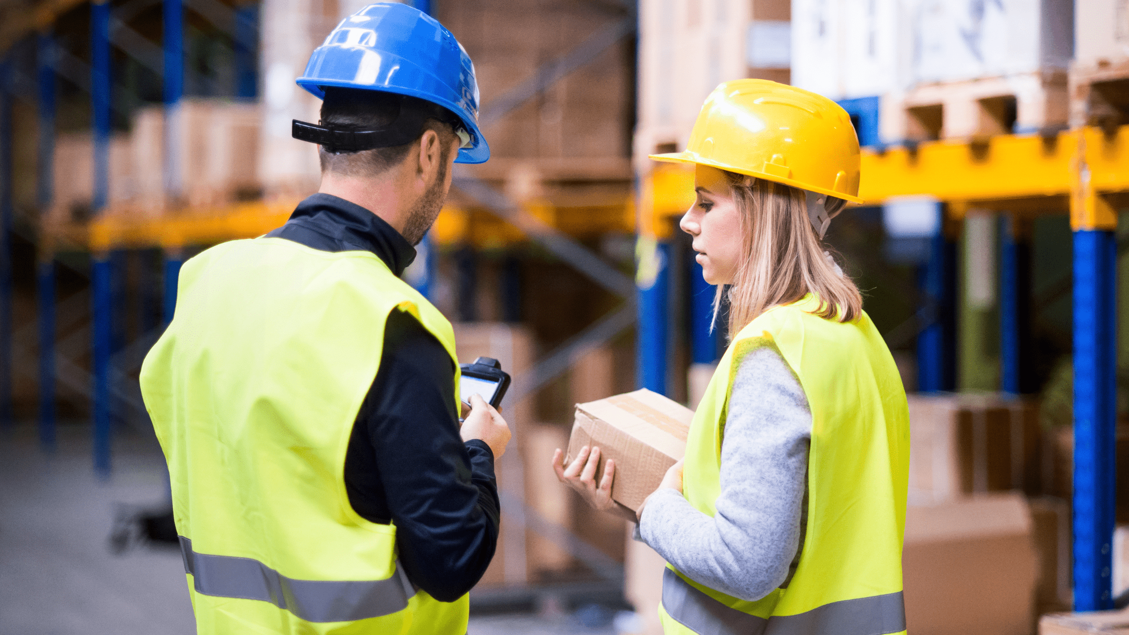 Two people checking off safety Investing in Warehouse Safety Saves You Money