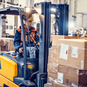 forklift driver with HIT-NOT safely moving boxes