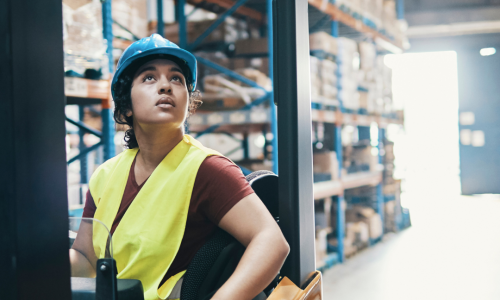 female forklift operator looking at load female forklift operator looking at load