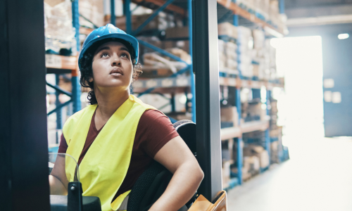 female forklift operator looking at load